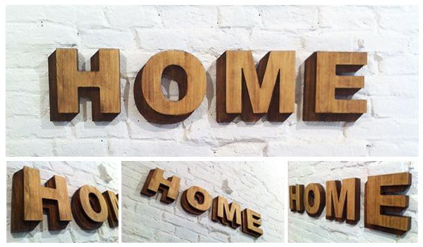Rótulo palabra home con relieve que simula sombra Jugando con las sombras